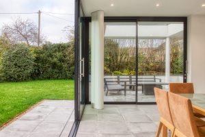 Low and flush thresholds for bifolding or sliding doors