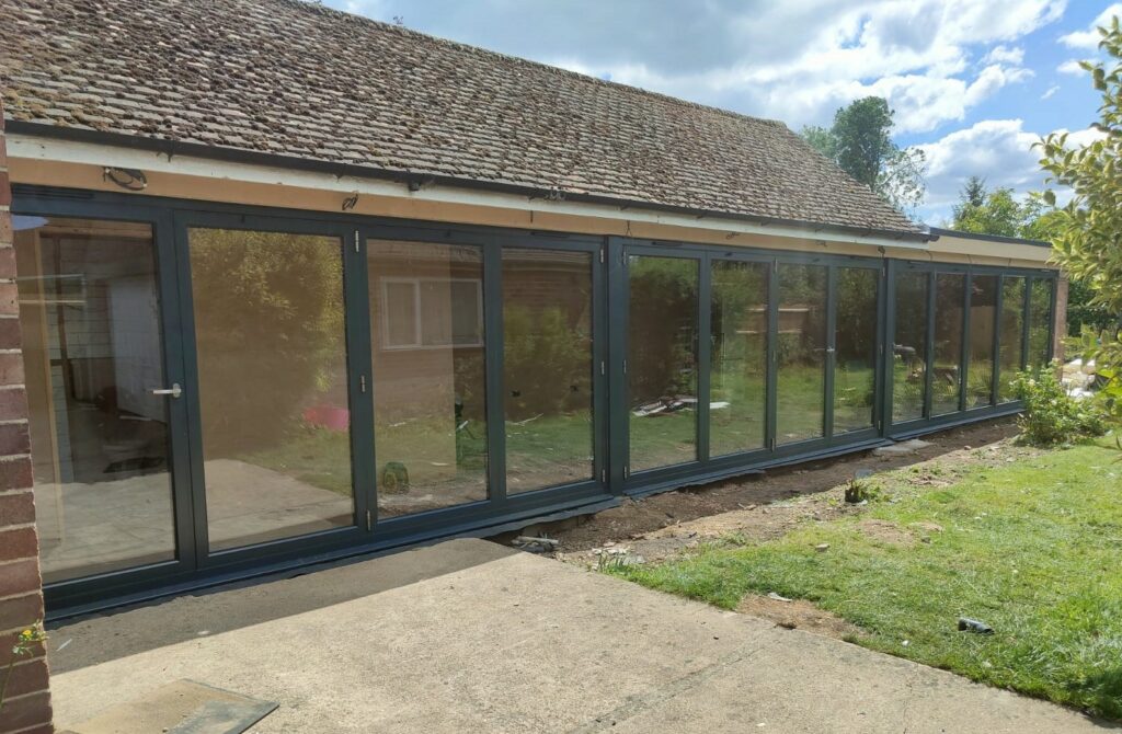 origin bifold doors three sets across a new build extension